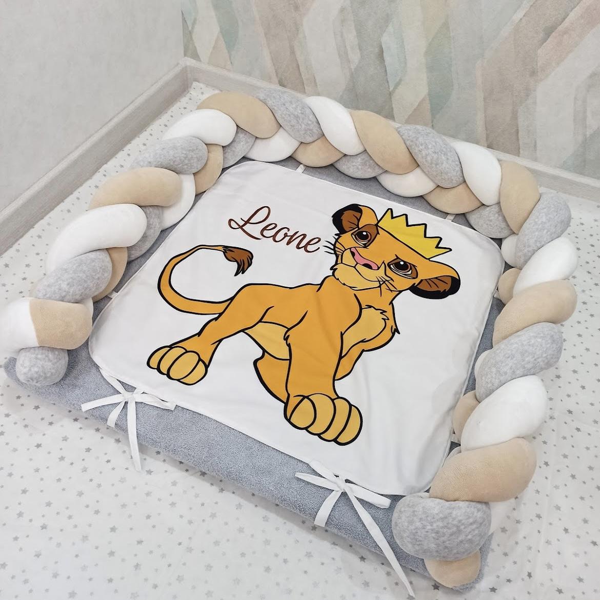 Changing mat with the beige-white lion king Simba print